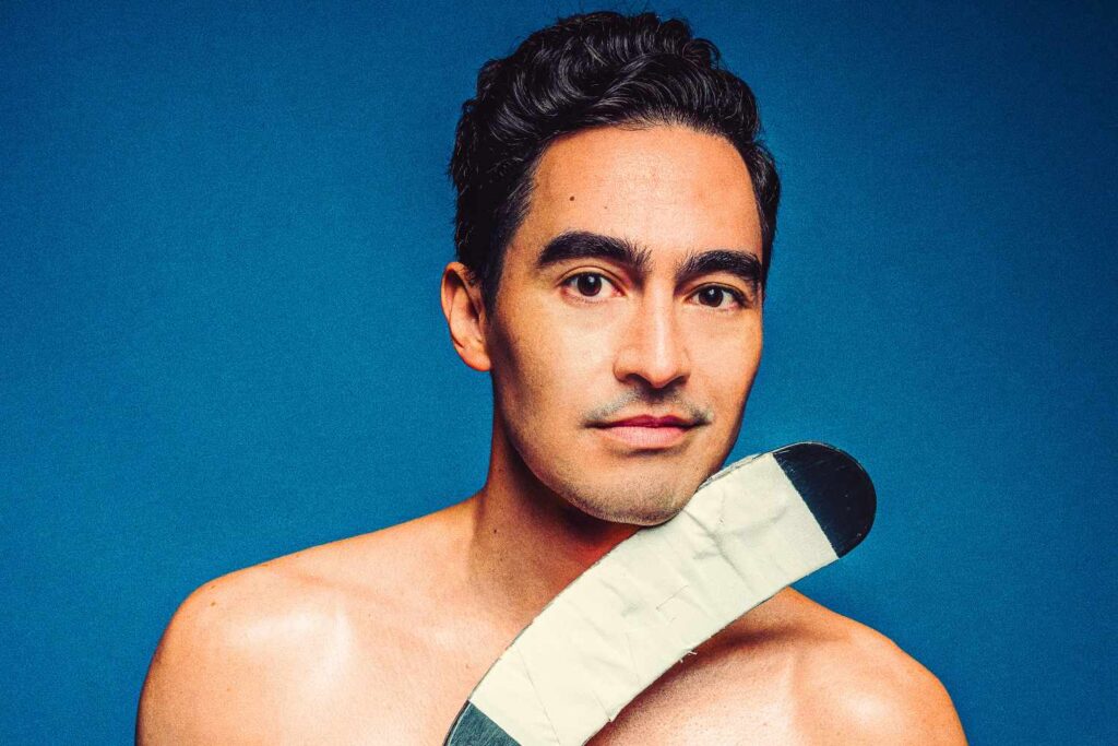 Troy Iwata Slips into Shane Hollander’s Skates for “Heated Rivalry” Musical Parody — and He’s Having Pucking Fun Doing It (Exclusive)