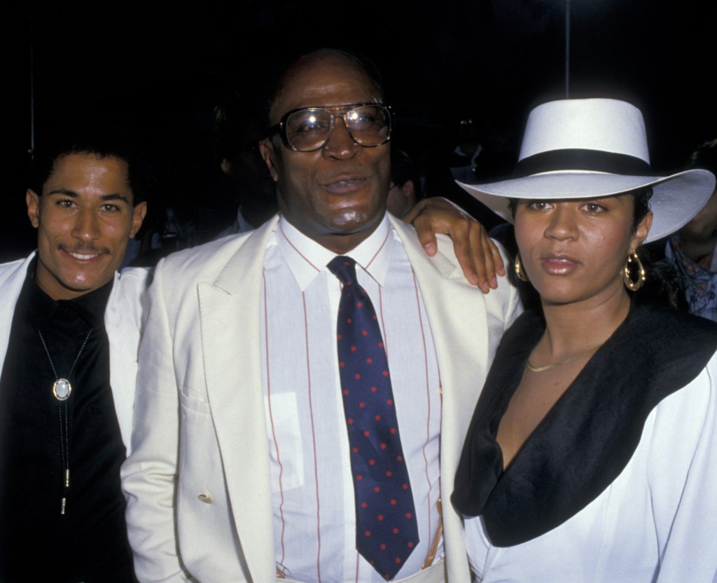 John Amos, wife Noel Amos and son Kelly Amos attend the premiere of "Coming To America" on June 26, 1988 at Mann Chinese Theater in Hollywood, California. (Photo by Ron Galella, Ltd./Ron Galella Collection via Getty Images)