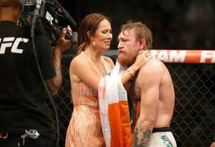 Conor McGregor celebrates with girlfriend Dee Devlin after defeating Chad Mendes during their interim featherweight title mixed martial arts bout at UFC 189, in Las Vegas
UFC 189 Mixed Martial Arts, Las Vegas, USA