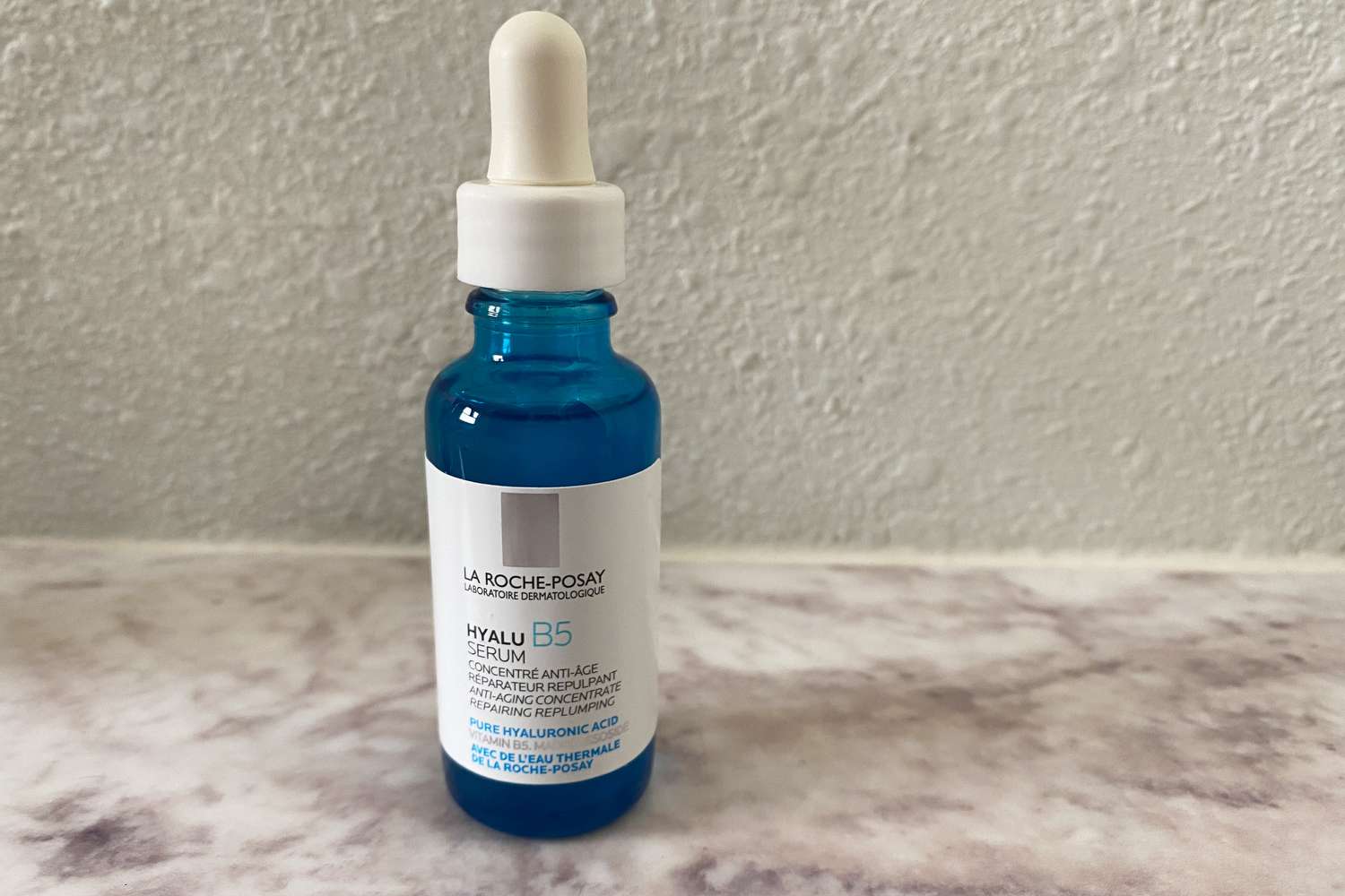 La Roche-Posay Hyalu B5 Pure Hyaluronic Acid Serum displayed on marble countertop