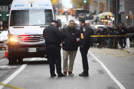 NEW YORK, NEW YORK - DECEMBER 04: Police gather outside of a Hilton Hotel in Midtown Manhattan where United Healthcare CEO Brian Thompson was fatally shot on December 04, 2024 in New York City. Brian Thompson was shot and killed before 7:00 AM this morning outside the Hilton Hotel, just before he was set to attend the company's annual investors' meeting. (Photo by Spencer Platt/Getty Images)