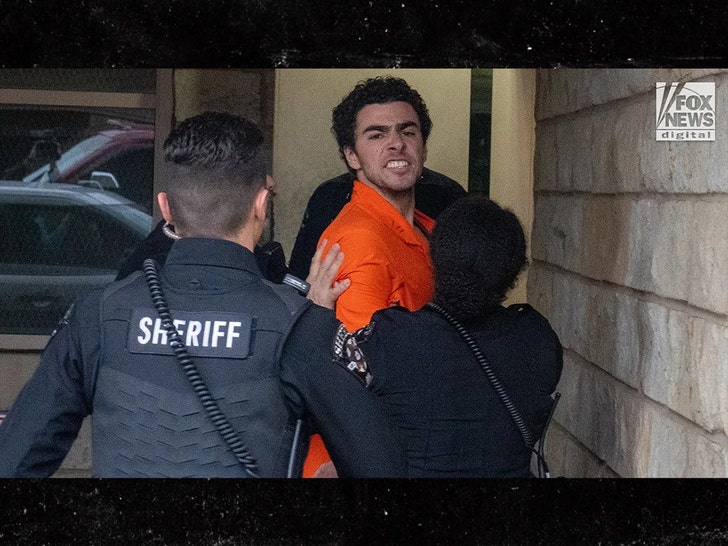 Luigi Mangione escorted by deputies