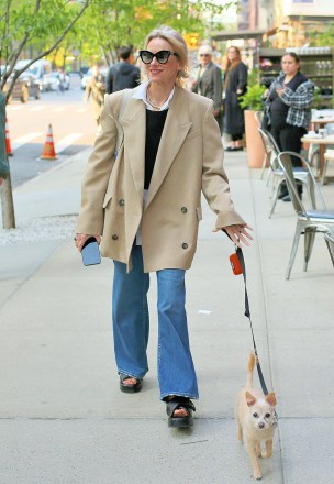 Naomi Watts shows off what appears to be an engagement ring outside the Greenwich Hotel while walking her dog in New York City. Naomi then appears to hide the ring by covering it with her cellphone.Pictured: Naomi WattsRef: SPL5542870 260423 NON-EXCLUSIVEPicture by: Christopher Peterson / SplashNews.comSplash News and PicturesUSA: +1 310-525-5808London: +44 (0)20 8126 1009Berlin: +49 175 3764 166photodesk@splashnews.comWorld Rights