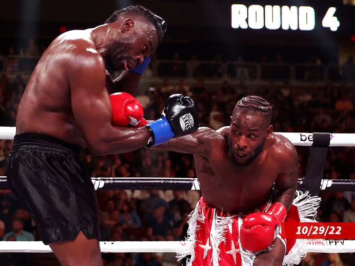 Le’Veon Bell (R) punches Uriah Hall of Jamaica during their cruiserweight bout at Desert Diamond Arena