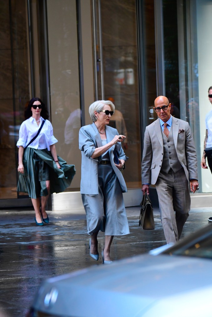 Anne Hathaway Walking Behind Meryl Streep & Stanley Tucci