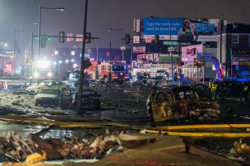 PHILADELPHIA, UNITED STATES - JANUARY 31: A view of the wreckage from a small plane after it crashed in a residential area in the US city of Philadelphia on January 31, 2025. The aircraft, reportedly an air ambulance, took off from the Northeast Philadelphia Airport when went down around 6.30 p.m. local time (2330GMT), igniting multiple fires. (Photo by Thomas Hengge/Anadolu via Getty Images)