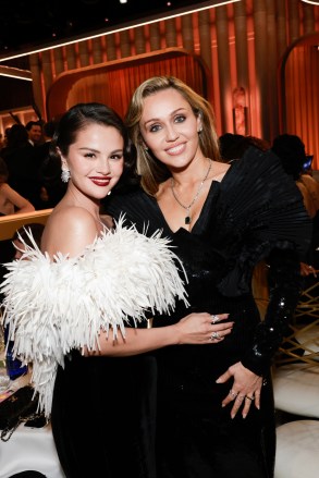 Selena Gomez and Miley Cyrus at the 83RD ANNUAL GOLDEN GLOBES®, airing live from the Beverly Hilton in Beverly Hills, California on Sunday, January 11, 2026 at 8 PM ET/5 PM PT, on CBS and streaming on Paramount+. Photo: Francis Specker/CBS ©2026 CBS Broadcasting, Inc. All Rights Reserved.