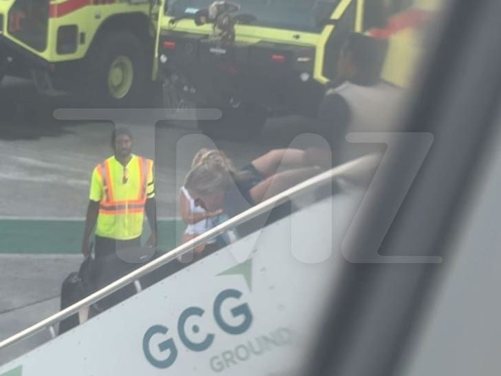 012326_karen_dragged_off_flight_stairs