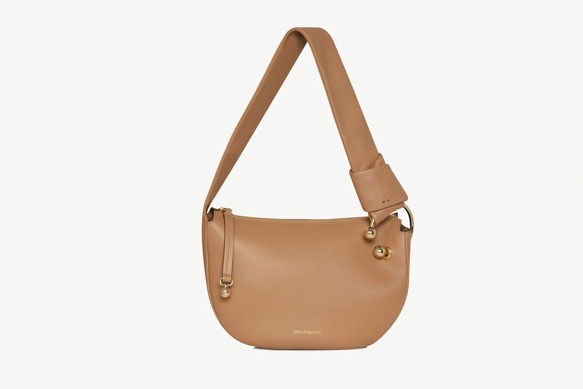 Tan leather shoulder bag with gold accents.