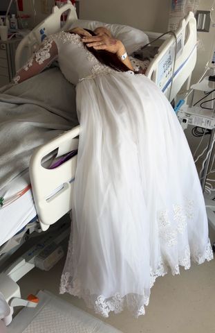 Alexis Cowan hugging her grandfather, Jim Mahan, in the hospital Courtesy of Alexis Cowan