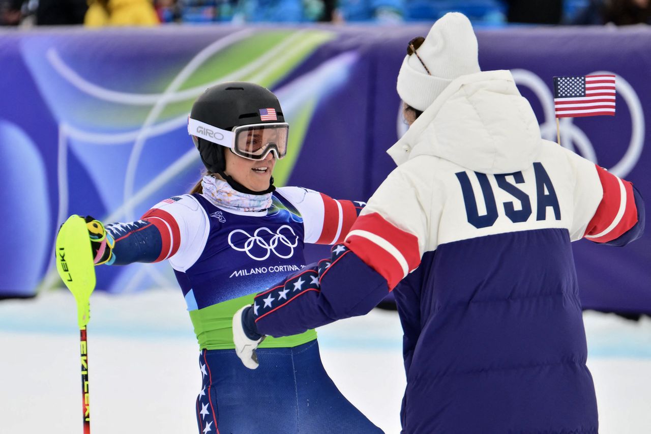 Paula Moltzan, left, hugs Jacqueline Wiles at the women's team combined event at the 2026 Winter Olympics Stefano RELLANDINI / AFP via Getty