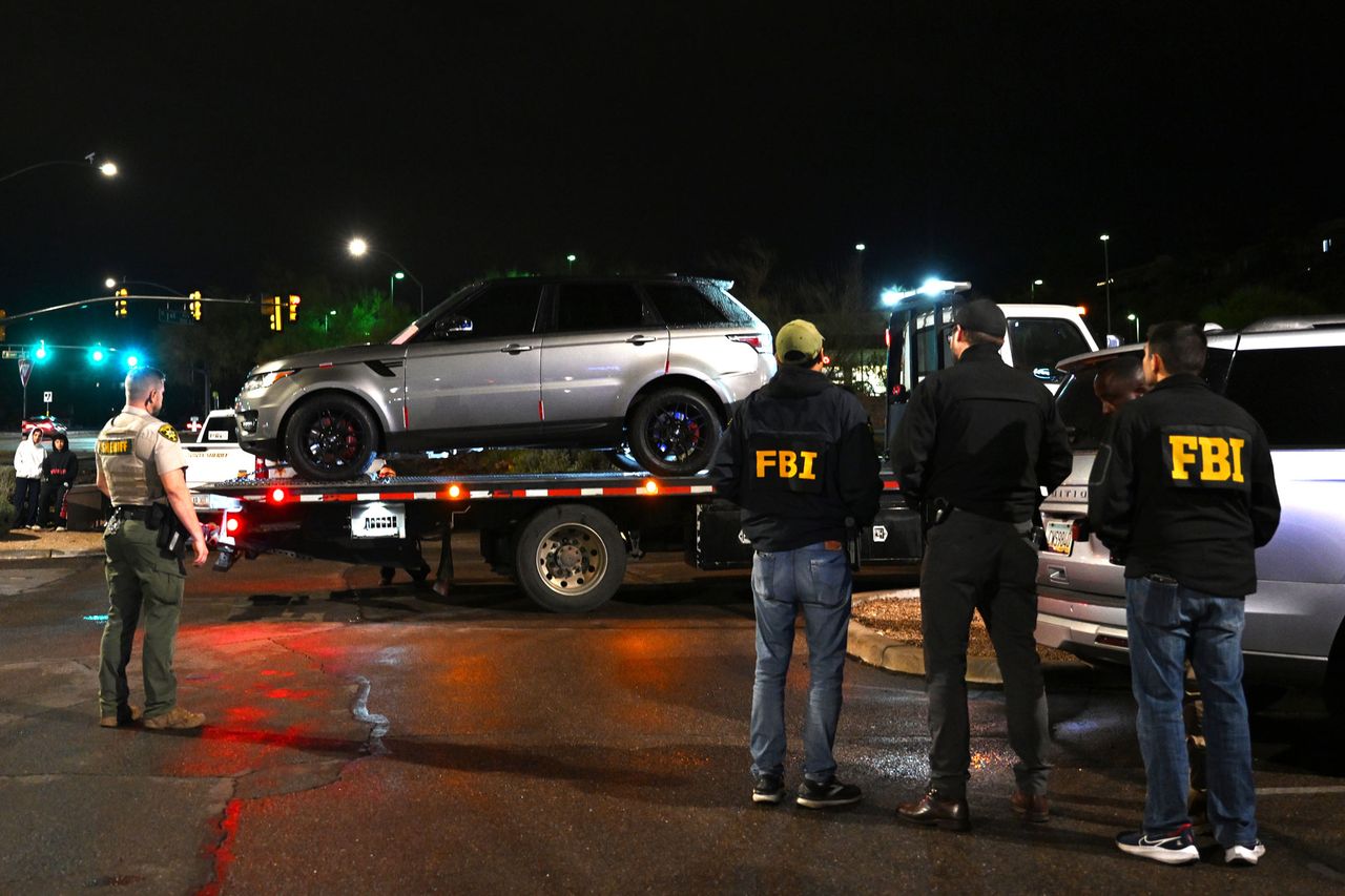 FBI agents watch as a vehicle is towed from the parking lot of a restaurant on February 13, 2026 FBI agents watch as a vehicle is towed from the parking lot of a restaurant in Tucson, Ariz., on Feb. 13, 2026 Brandon Bell/Getty