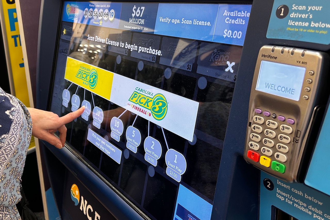 A person purchasing lottery tickets (stock image).  Lindsey Nicholson/UCG/Universal Images Group via Getty