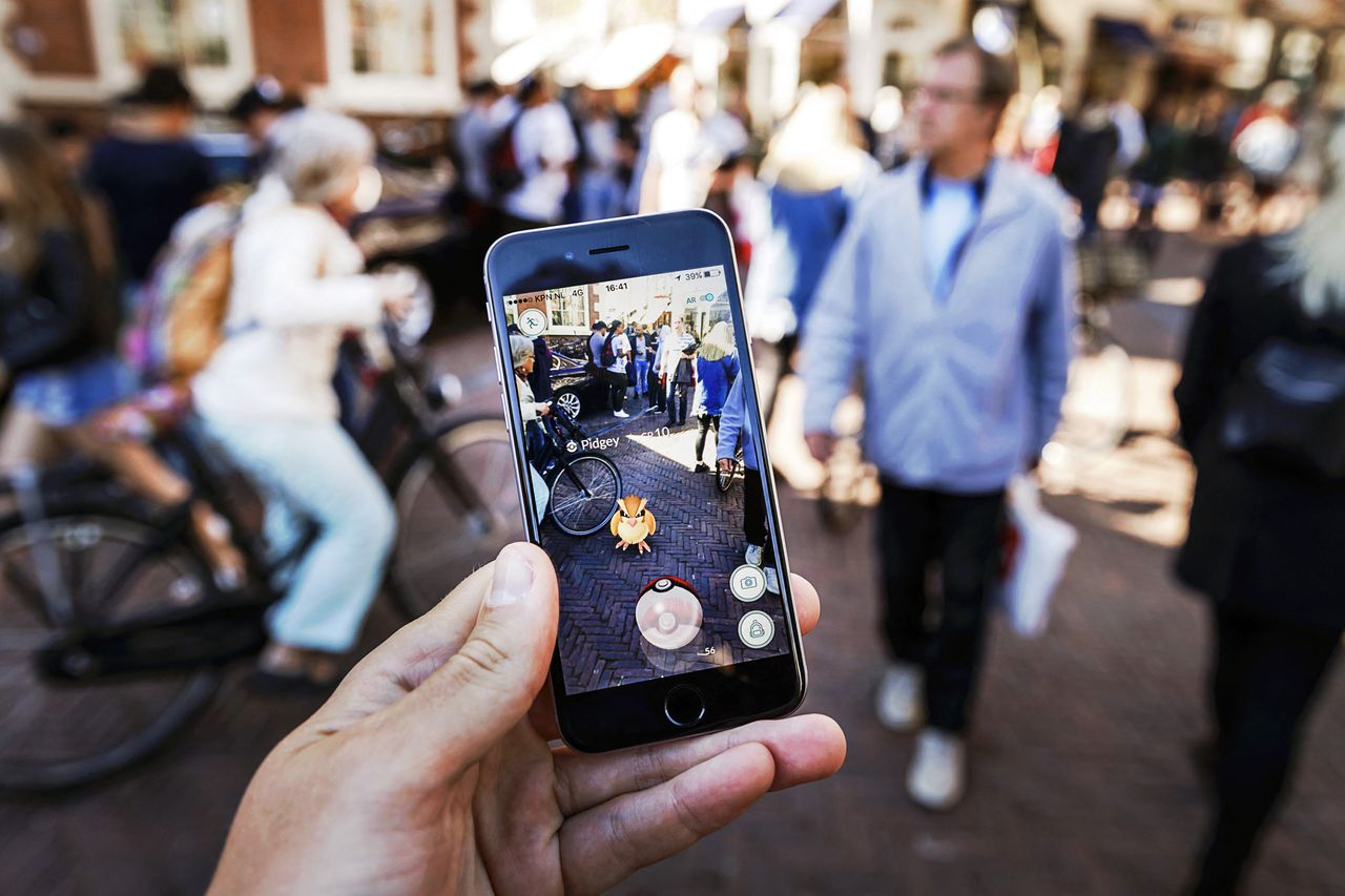 Gamers play with the Pokemon Go application on their mobile phone, at the Grote Markt in Haarlem, on July 13, 2016. Pokémon GoCredit: REMKO DE WAAL/ANP/AFP/Getty