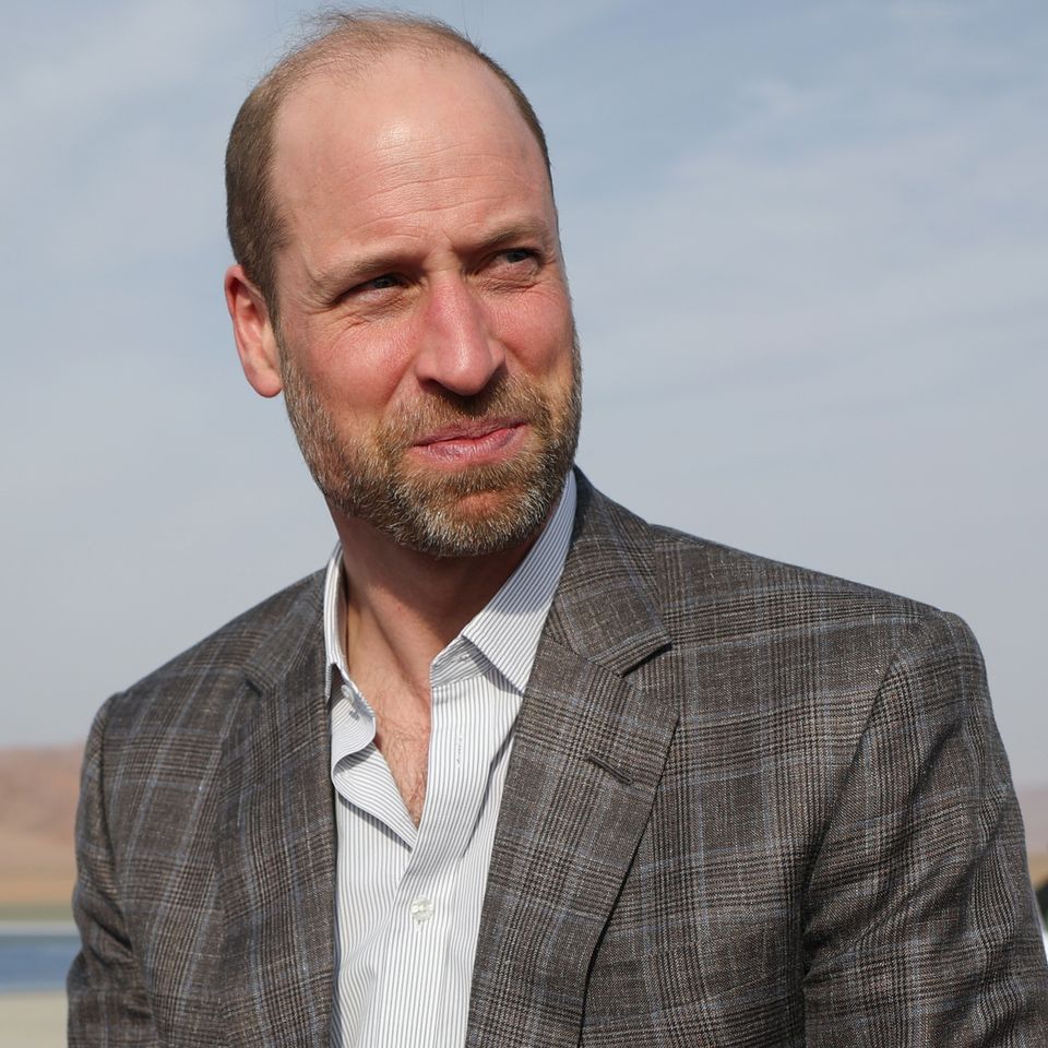 Prince William, Prince of Wales looks on before boarding a Royal Air Force (RAF) plane to depart from AlUla Prince William Isabel Infantes - Pool/Getty