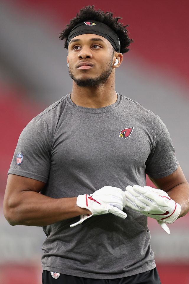 GLENDALE, ARIZONA - NOVEMBER 26: Wide receiver Rondale Moore #4 of the Arizona Cardinals warms up before the NFL game against the Los Angeles Rams at State Farm Stadium on November 26, 2023 in Glendale, Arizona. The Rams defeated the Cardinals 37-14. Wide receiver Rondale Moore #4 of the Arizona Cardinals Christian Petersen/Getty