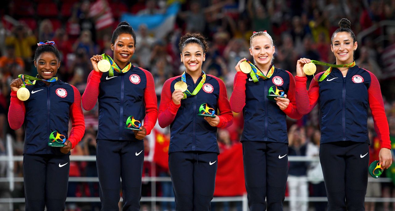 Gold Medalists Simone Biles, Gabrielle Douglas, Lauren Hernandez, Madison Kocian and Alexandra Raisman of the United States celebrate on the podium at the medal ceremony for the Artistic Gymnastics Women's Team on Day 4 of the Rio 2016 Olympic Games at the Rio Olympic Arena on Aug. 9, 2016 in Rio de Janeiro, Brazil. Laurence Griffiths/Getty 