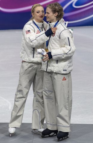 Amber Glenn embraces Ilia Malinin as the United States team celebrates their gold medal win Amber Glenn embraces Ilia Malinin at the 2026 Winter Olympics Tim Clayton/Getty