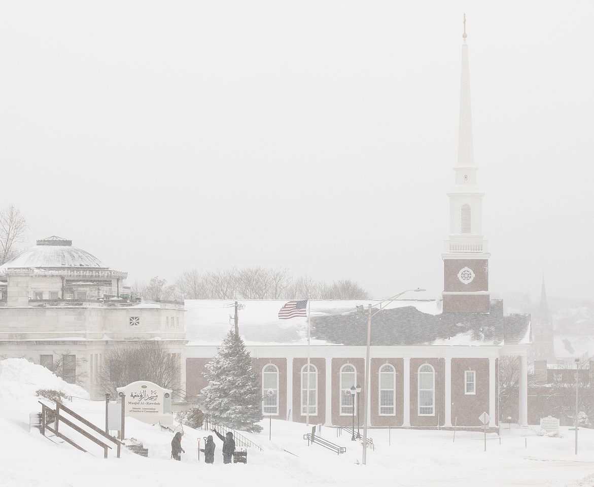 Shovel crews confer along East Main Street in Meriden near First United Methodist Church, right, as a powerful nor'easter brings blizzard conditions in Connecticut, Monday, February 23, 2026. Connecticut blizzard Dave Zajac/Connecticut Post via Getty