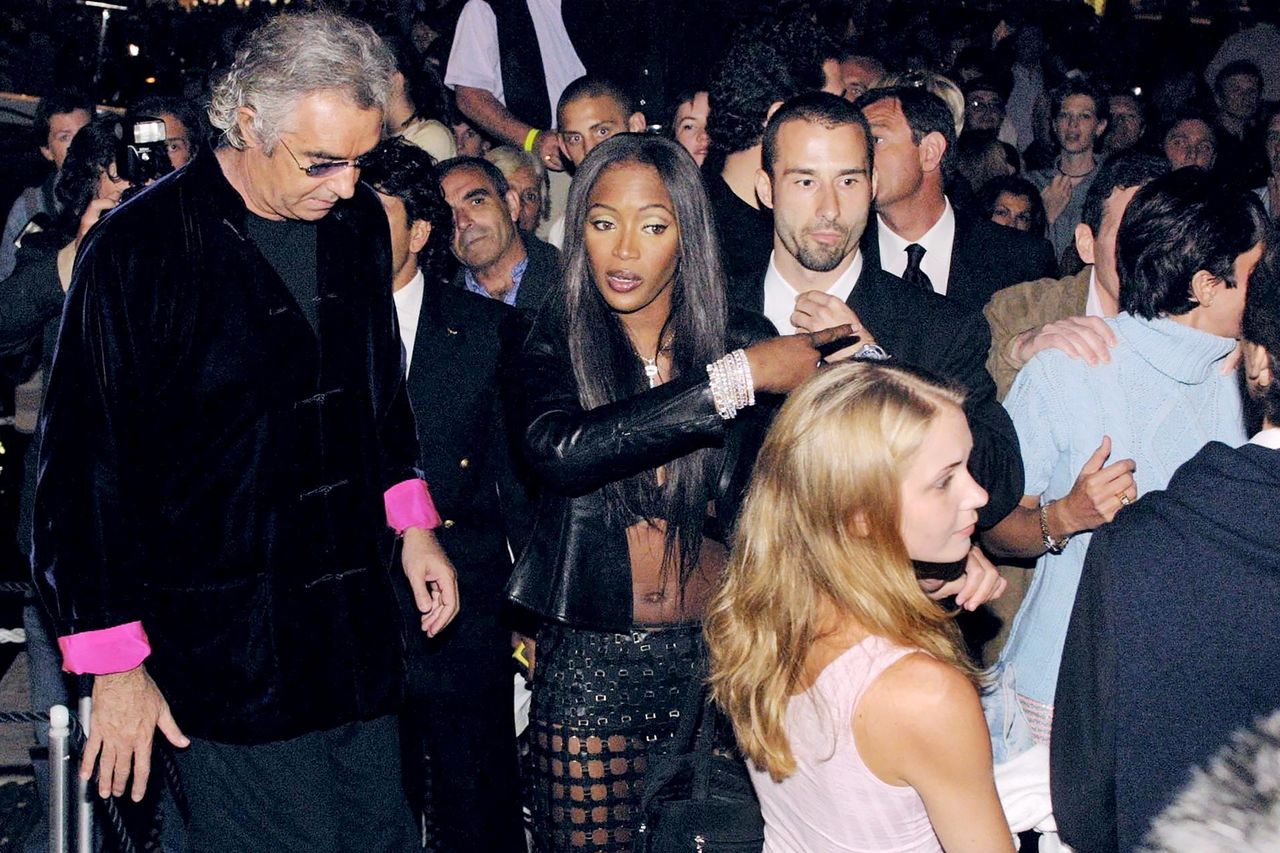 Italian entrepreneur Flavio Briatore and British top model Naomi Campbell at her 31st birthday party in St Tropez, France, 19th May 2001; Virginia Roberts is in the foreground with Ghislaine Maxwell on right Naomi Campell at her 2001 birthday with Virginia Giuffre (in pink) and Ghislaine Maxwell (in blue) Pool LAFARGUE/LENHOF/Gamma-Rapho via Getty