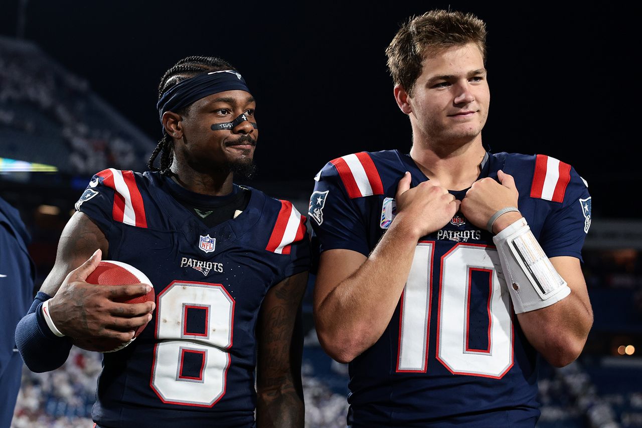 Stefon Diggs #8 and Drake Maye #10 of the New England Patriots on October 5, 2025 in Orchard Park, New York Kathryn Riley/Getty