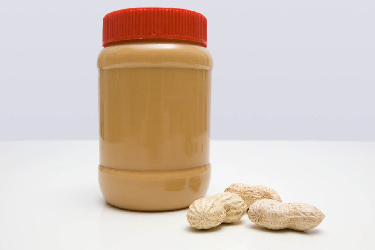 Jar of peanut butter and peanuts Peanut butter and peanuts (stock image). Getty