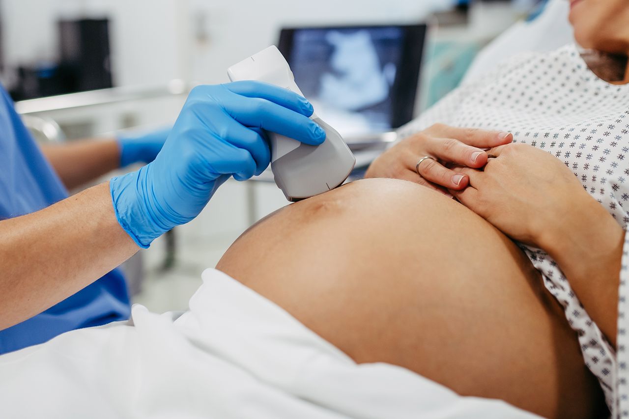 Ob/gyn doctor doing ultrasound of baby on pregnant woman. Woman having sonogram. Prenatal visit or care during third trimester of pregnancy. Pregnant woman on pregnancy check-up in gynaecologist doctor's office. A doctor doing an ultrasound on a pregnant woman (stock image)Credit: Getty