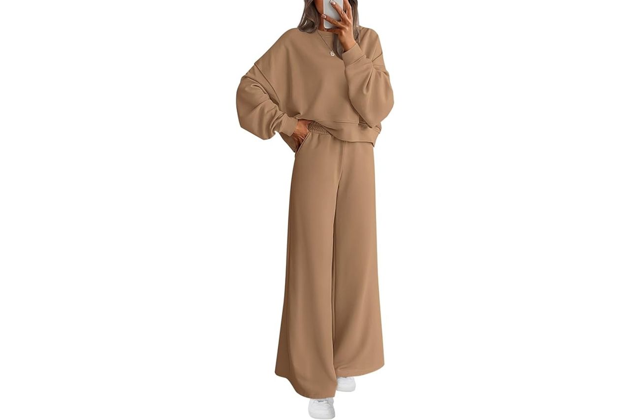 A person standing wearing a cozy loungewear set consisting of a sweatshirt and wideleg pants hand on hip Amazon