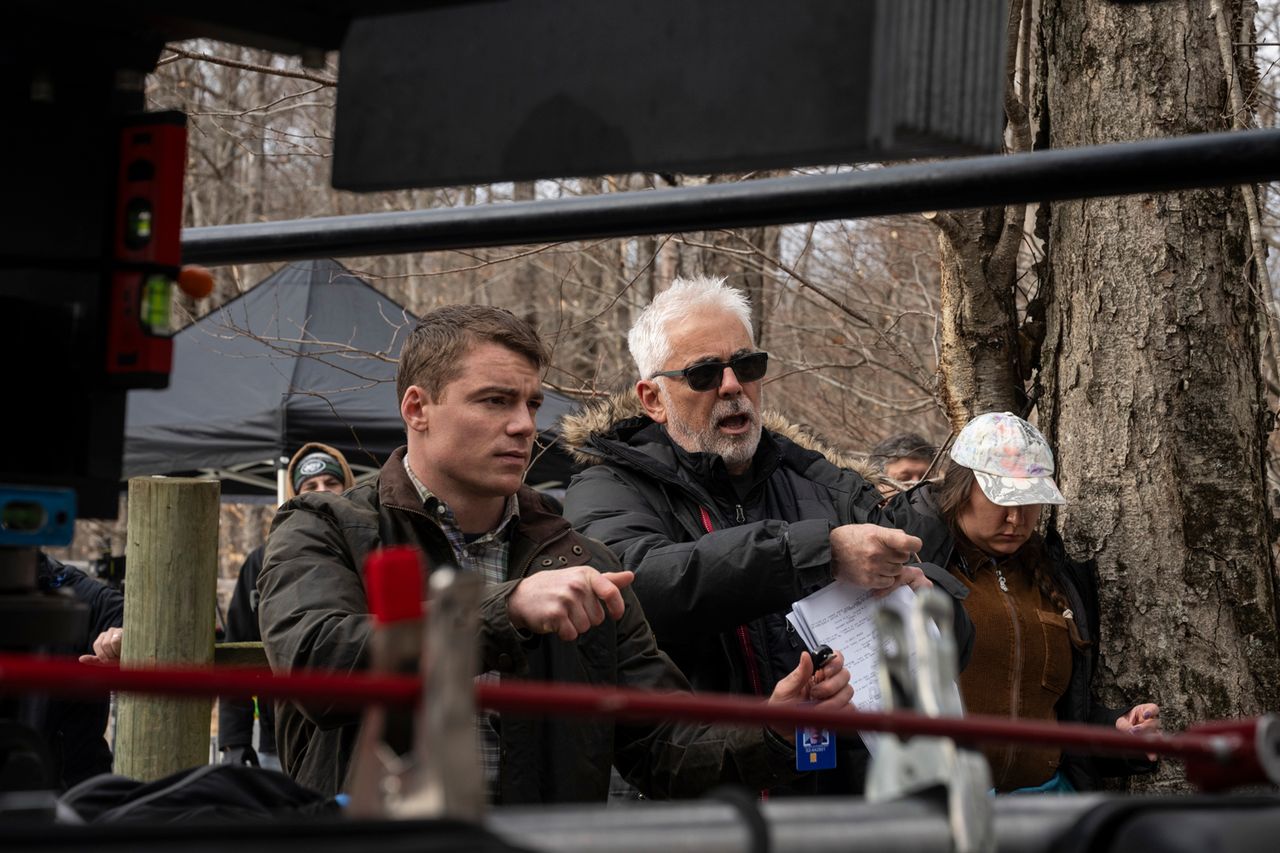 Gabriel Basso as Peter Sutherland and Director Adam Arkin on set of The Night Agent. Christopher Saunders/Netflix