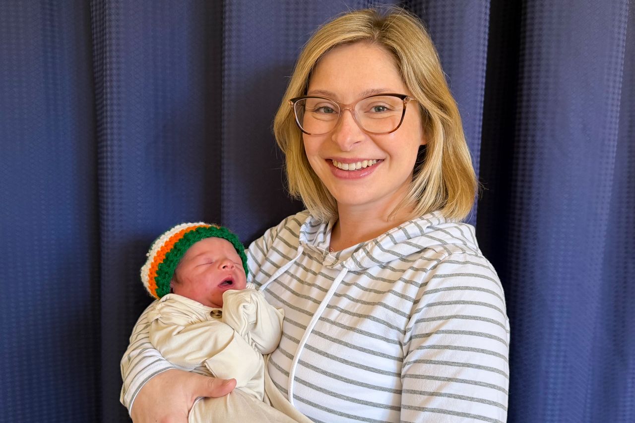 Caitlyn O’Brien holding her newborn baby son.Credit: UMass Memorial Health
