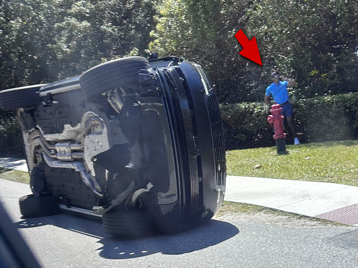 tiger woods car AP 1 arrow