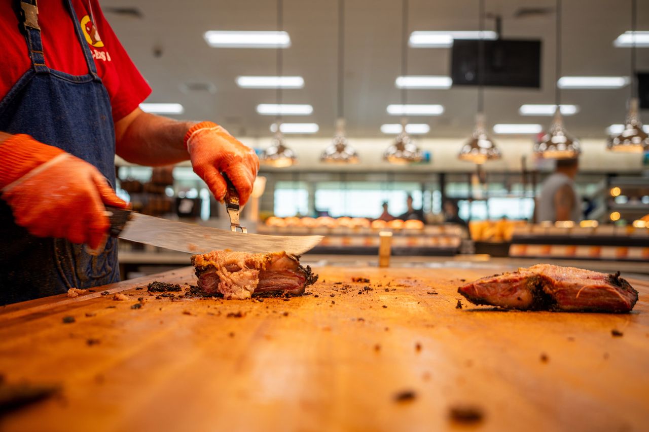 An employee prepares brisket inside of the Buc-ee's convenience store on June 12, 2024 in Luling, TexasCredit: Brandon Bell/Getty