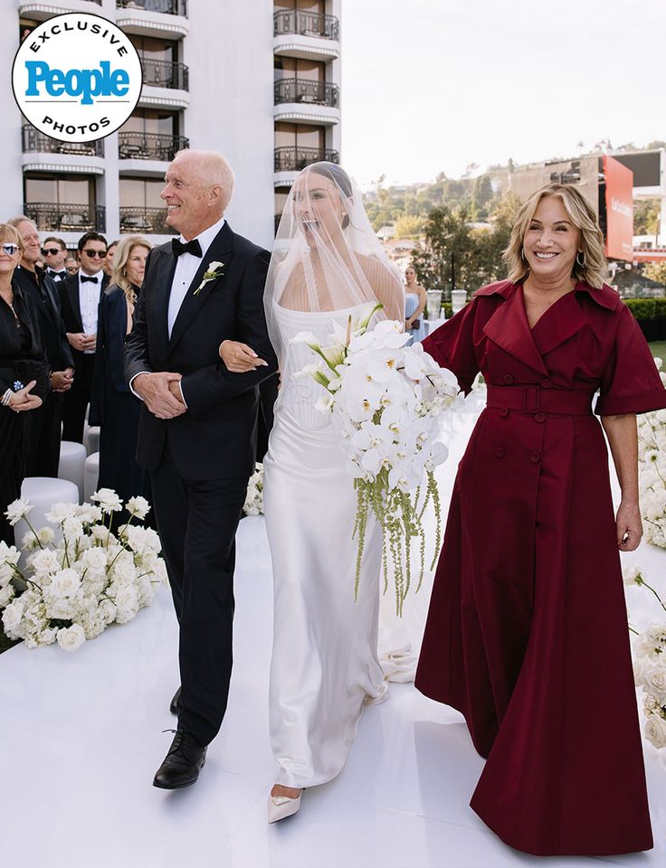 Carly Frei walks down the aisleCredit: izzie karren