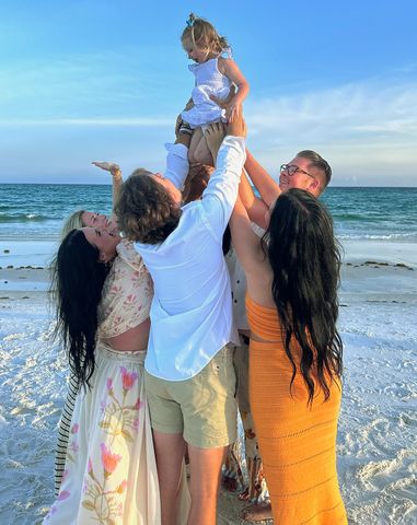 The Bennett family holding up Laken.Credit: Courtesy of Hannah Whitson