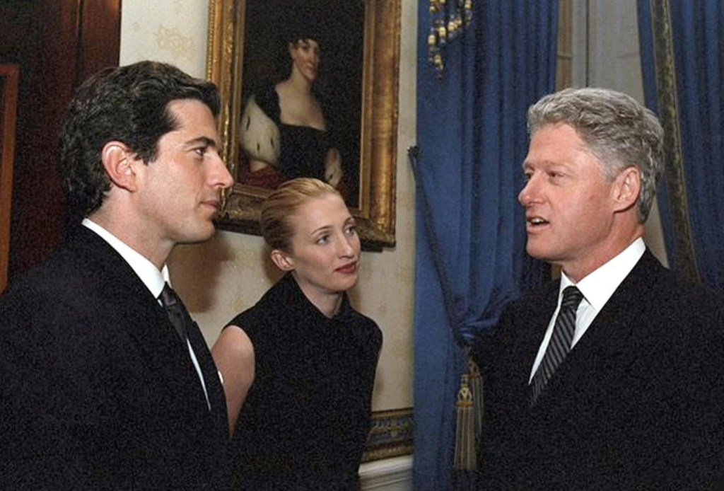 This 05 March 1998 photo released by the White House 21 July 1999, shows US President Bill Clinton during a tour of the White House with John F. Kennedy Jr and Carolyn Bessette Kennedy in the Blue Room of the White House in Washington, DC. (Photo by WHITE HOUSE / WHITE HOUSE / AFP) (Photo by WHITE HOUSE/WHITE HOUSE/AFP via Getty Images)