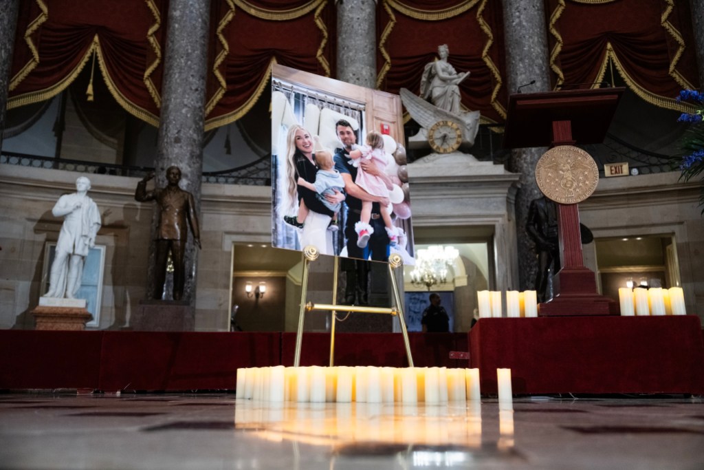 UNITED STATES - SEPTEMBER 15: A photo of political media personality Charlie Kirk, his children and wife, Erika, is seen after an all-member memorial service in the U.S. Capitol’s Statuary Hall on Monday, September 15, 2025. Kirk was murdered during an event at Utah Valley University on September 10, 2025. (Tom Williams/CQ Roll Call)
