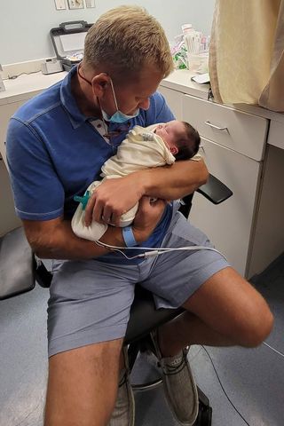 Ron Bassett holding baby Laken.Credit: Courtesy of Hannah Whitson