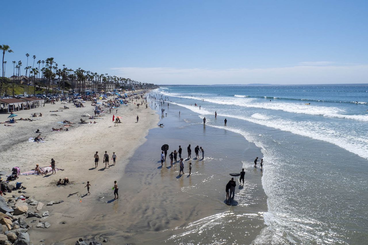 Swimmers at Oceanside, Calif.Credit: Getty