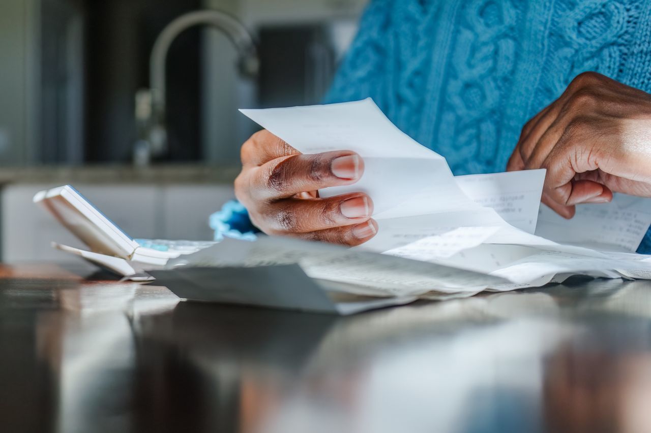 Close-up of unrecognizable black woman reviewing receipts A woman reviewing bill (stock image)Credit: Getty