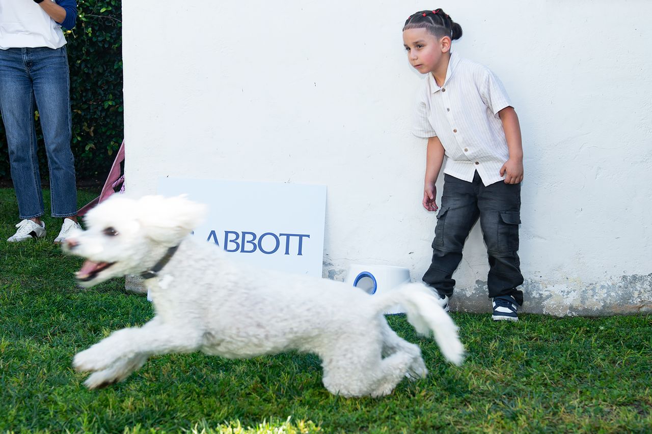 Dog chases after ball thrown by child at Abbott event in Los AngelesCredit: Abbott