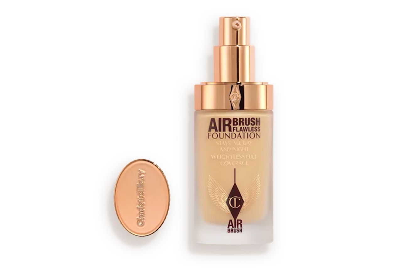 A bottle of Airbrush Flawless Foundation with a pump dispenser and lid product branding visible Credit: Charlotte Tilbury
