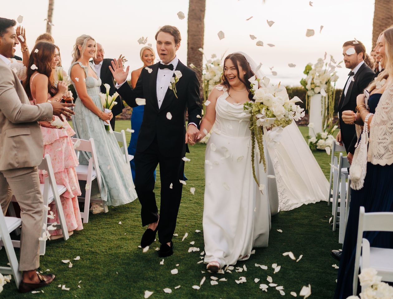 Emerson and Jordan Downing walking down the aisleCredit: Lyndsay Rae Photo