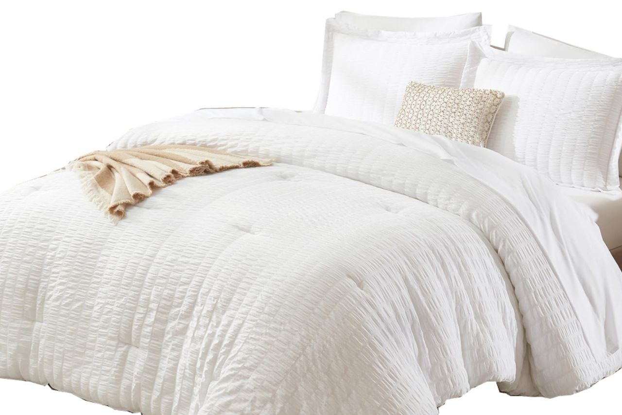 CozyLux Queen Comforter Set White Seersucker 7 Pieces Bed in a Bag Queen Comforter Set with Sheets, Luxury Soft Bedding Set with Down Alternative Comforter, Sheets, Pillowcases & Shams for All Seasons Credit: Amazon