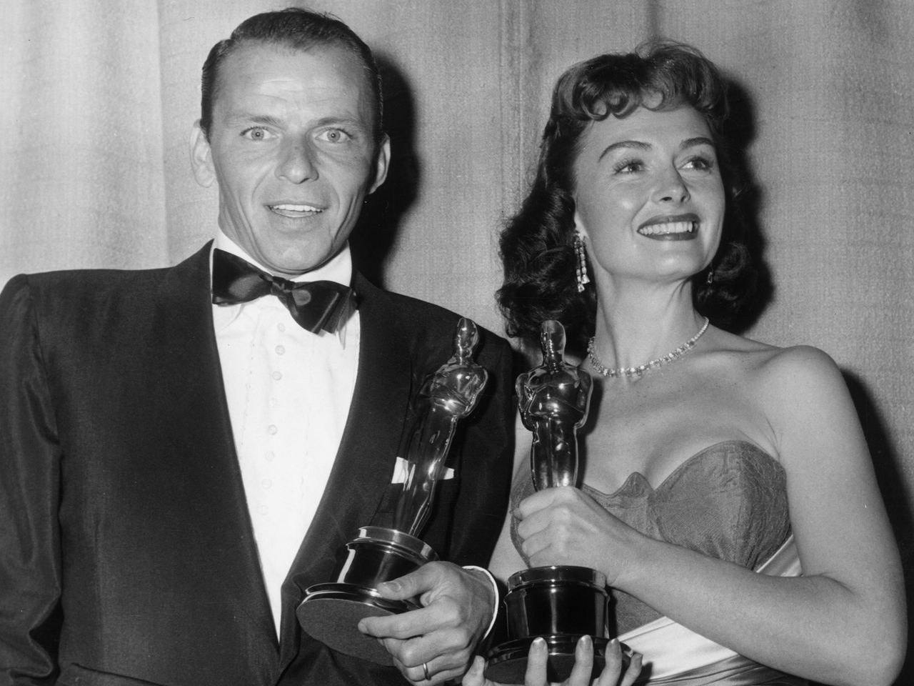 Frank Sinatra and Donna Reed accept the Oscar for Best Supporting Actor and Best Supporting Actress during the 26th Academy Awards at the RKO Pantages Theatre in L.A. on March 25, 1954Credit: Hulton Archive/Getty