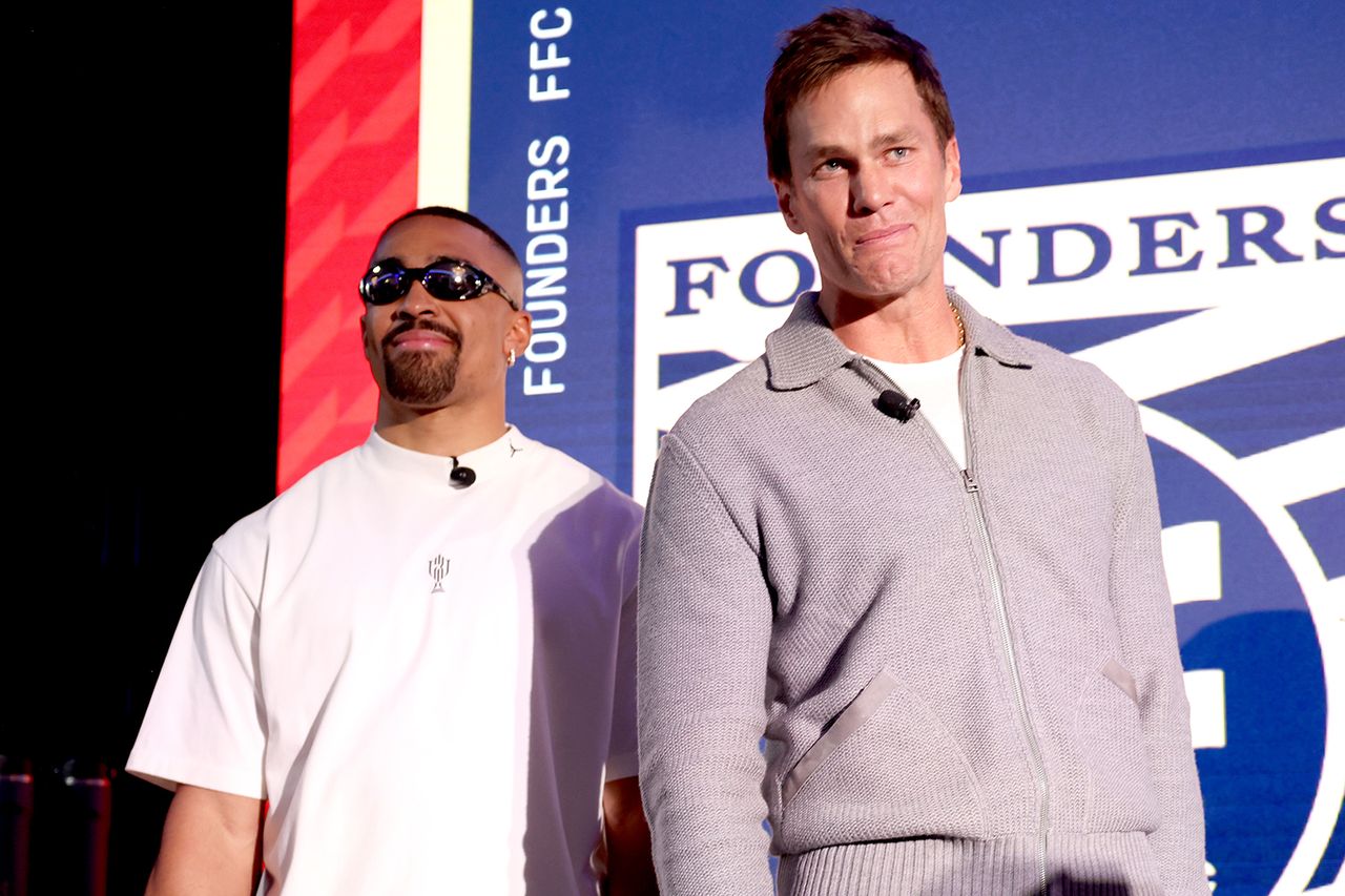 Quarterbacks Jalen Hurts and Tom Brady of the Founders FFC look on during the Fanatics Flag Football Classic Draft Jalen Hurts and Tom BradyCredit: Katelyn Mulcahy/Getty