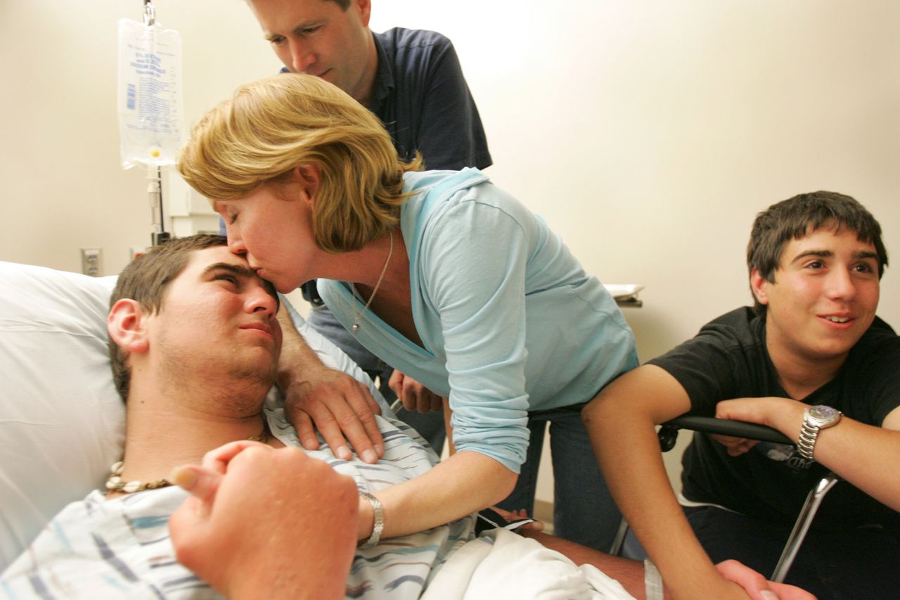 From left: Josh Long in the hospital in April 2005 with parents Eddie and Connie and brother JordanCredit: Alan Hawes/The Post And CourierBecky Baulch