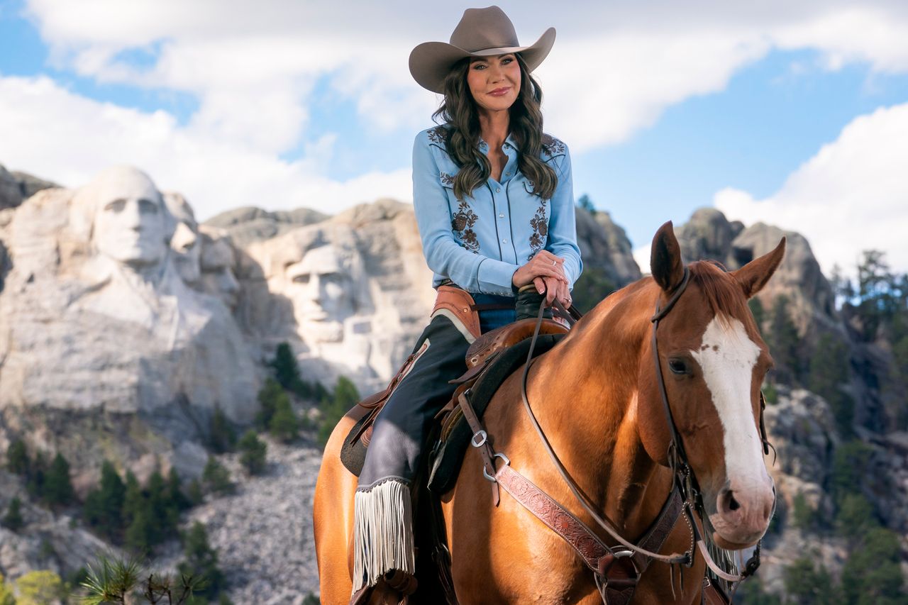 Homeland Security Secretary Kristi Noem on horseback at Mount Rushmore for a DHS adCredit: DHS photo by Tia Dufour