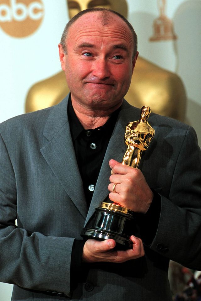 Phil Collins holds his Oscar for Best Original Song during the 72nd Academy Awards at the Shrine Auditorium in L.A. on March 26, 2000Credit: David McNew/Getty Images