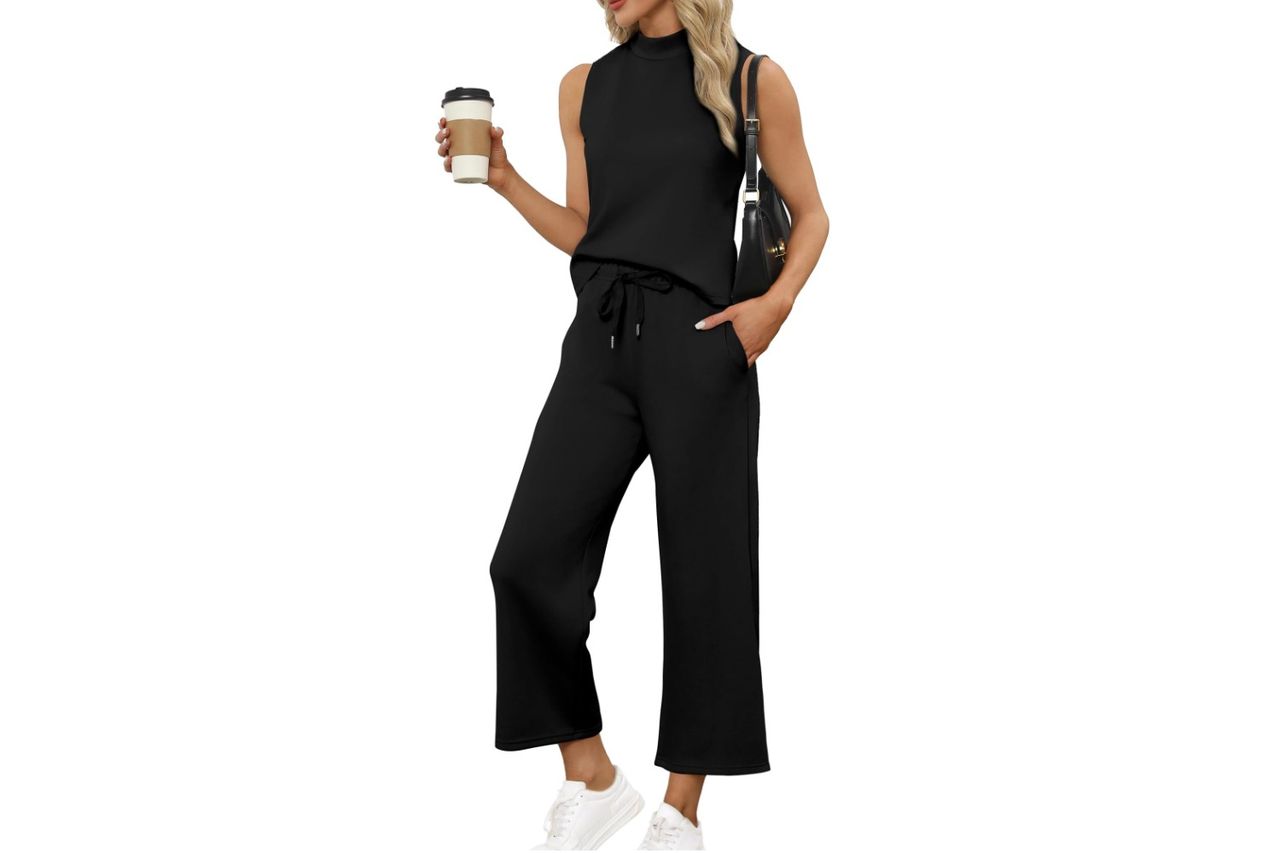 Woman wearing a twopiece lounge set with a mock neck top and holding a coffee Credit: Amazon