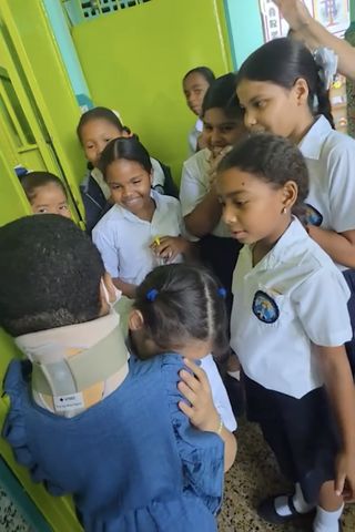 Girl, 8, Gets Heartwarming Welcome Back from Classmates After Spinal Surgery Paulina Liendo being welcomed back by her classmates after spinal surgeryCredit: SWNS